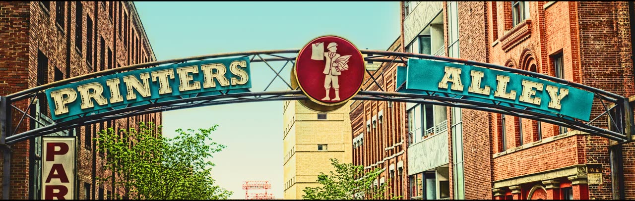 The Printers Alley sign arching over the street in downtown Nashville